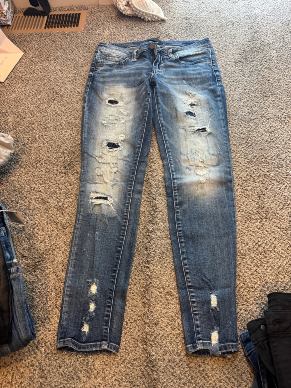 Buckle black skinny jeans